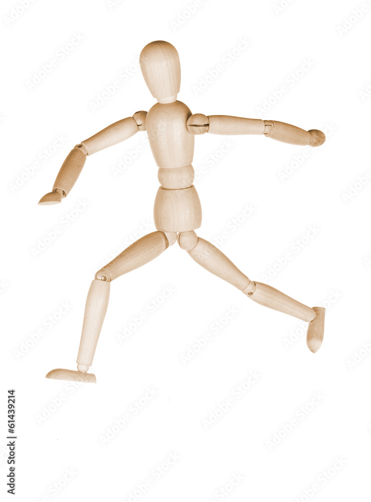 Wooden dummy in a pose of the running person Wooden dummy in a pose of the running person