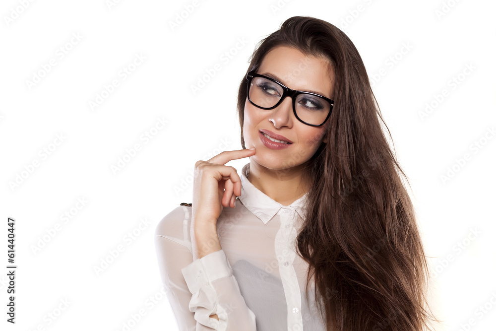 thoughtful smiling girl posing on a white background thoughtful smiling girl posing on a white background