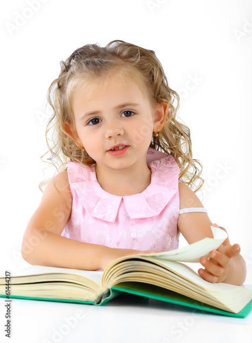 Beautiful smiling girl draws pencil