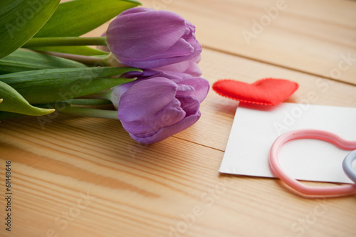 Beautiful tulip bouquet with hearts-symbols