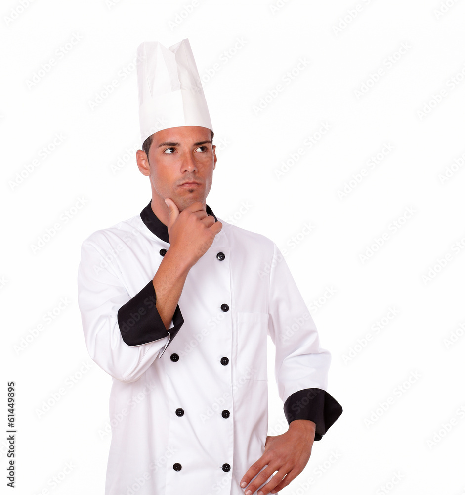 Pensive 20-24 years male chef standing