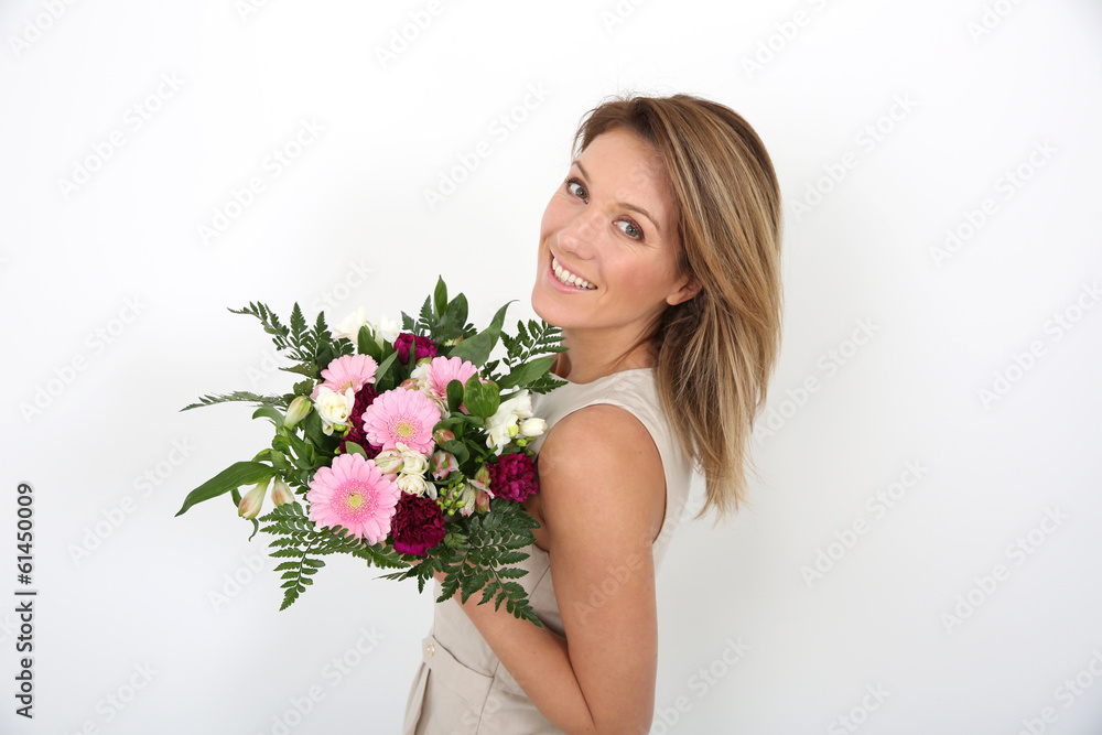 Happy woman holding bunch of flowers Happy woman holding bunch of flowers