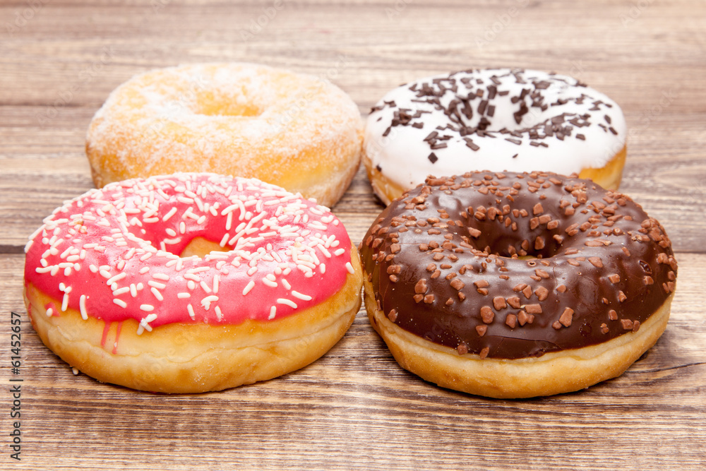 Tasty donuts on a wooden table Tasty donuts on a wooden table
