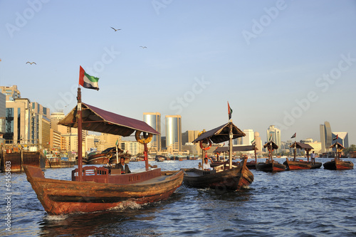 Canvas Print View of Deira quarter from Dubai creek with abra’s or water taxi