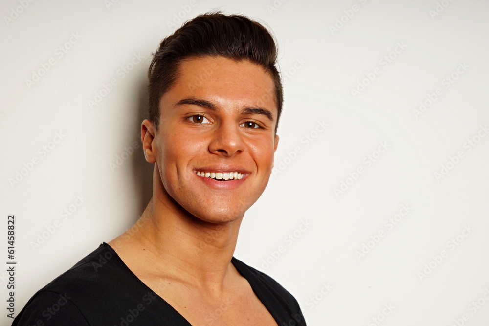 Portrait of handsome smiling young man at black shirt Portrait of handsome smiling young man at black shirt
