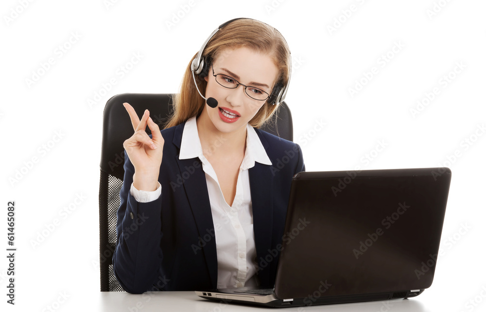 Beautiful business woman at call center is talking, sitting with Beautiful business woman at call center is talking, sitting with