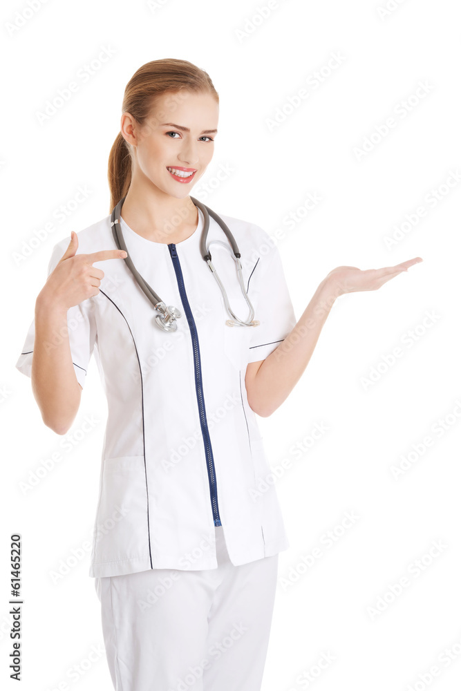 Beautiful caucasian doctor or nurse is presenting an abstract sp Beautiful caucasian doctor or nurse is presenting an abstract sp