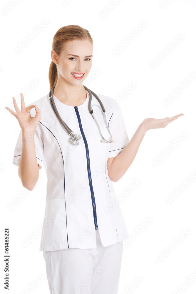 Beautiful caucasian doctor or nurse is presenting an abstract sp Beautiful caucasian doctor or nurse is presenting an abstract sp