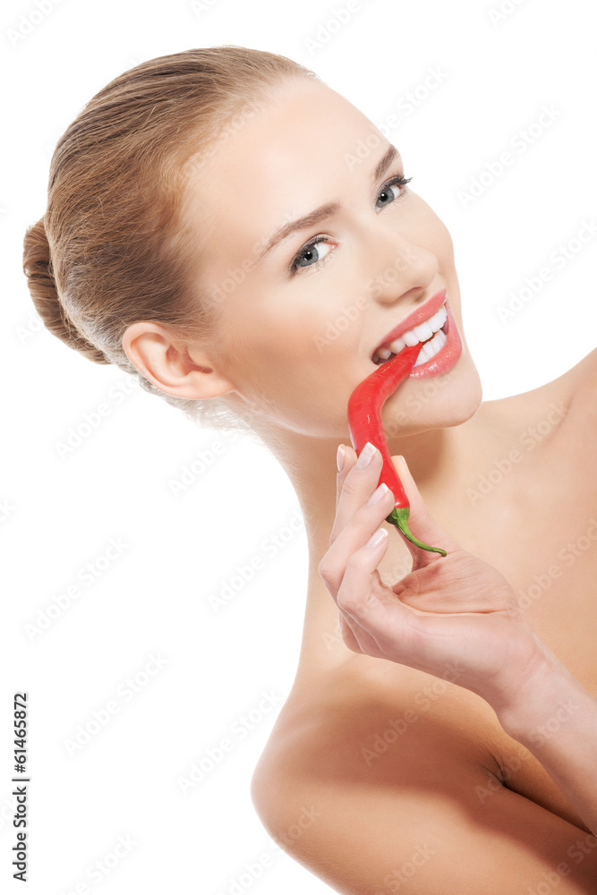 Beautiful caucasian topless woman with chili pepper in mouth. Beautiful caucasian topless woman with chili pepper in mouth.