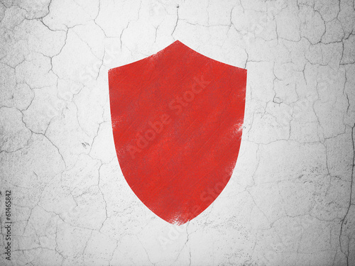 Safety concept: Shield on wall background