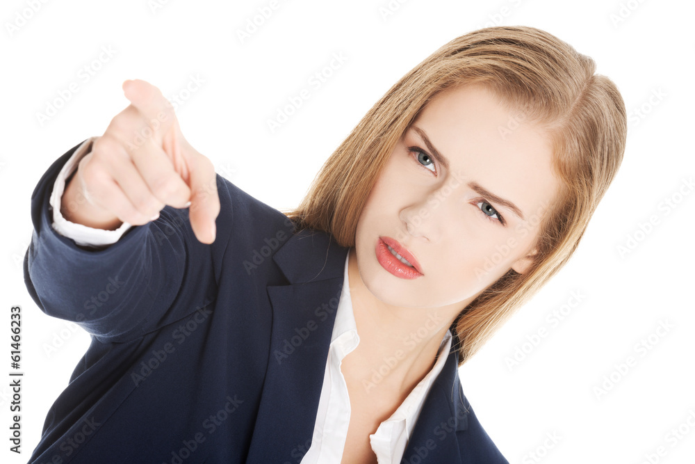 Beautiful business woman is showing warning sign. Beautiful business woman is showing warning sign.