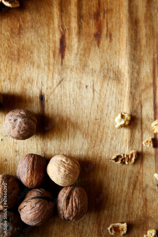 walnuts on old wooden background