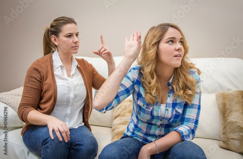 Furious mother arguing with her ​​teenage daughter