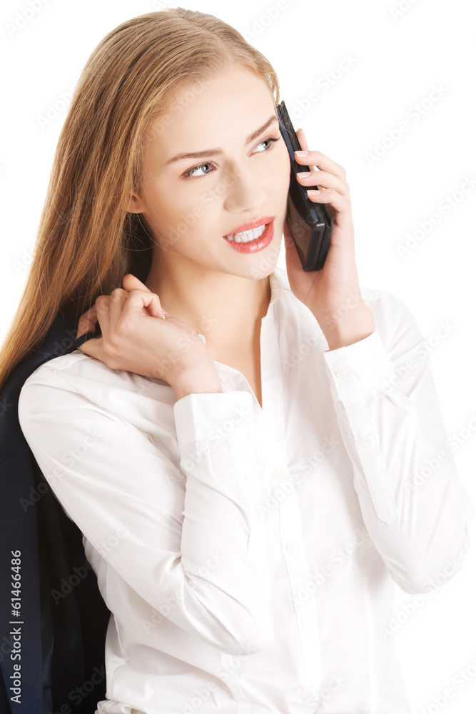 Beautiful caucasian business woman is talking through phone. Beautiful caucasian business woman is talking through phone.