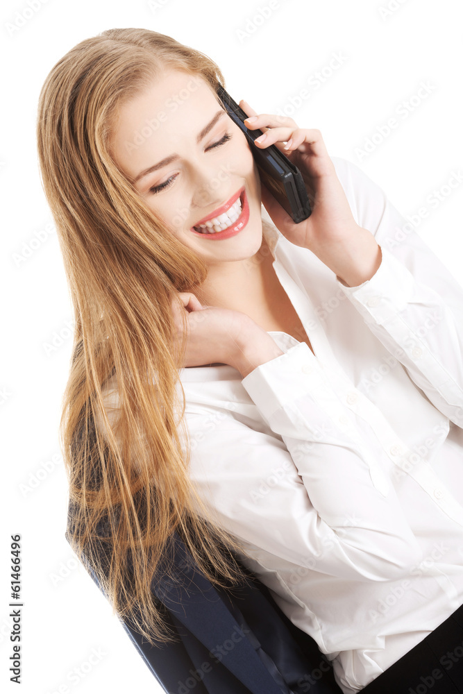Beautiful caucasian business woman is talking through phone. Beautiful caucasian business woman is talking through phone.