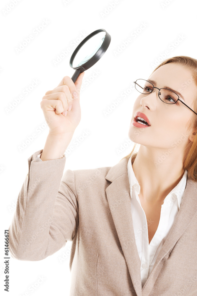 Beautiful caucasian business woman with magnifying glass. Beautiful caucasian business woman with magnifying glass.