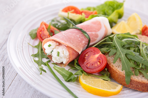 vegetable salad and ham rolled with cheese