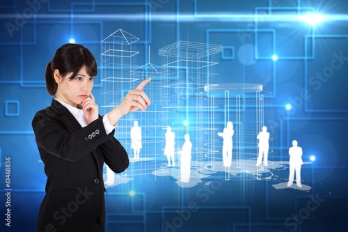 Composite image of thoughtful businesswoman pointing