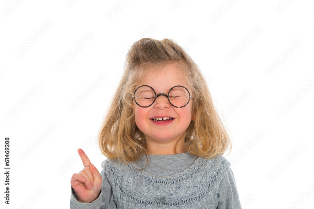 Mädchen mit runder Brille hebt den Zeigefinger Stock Photo | Adobe Stock