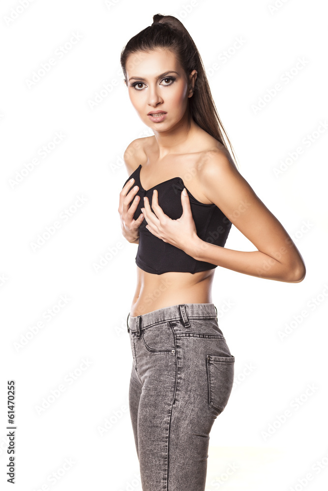 confused young woman holding her breasts confused young woman holding her breasts