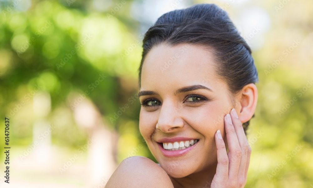 Close-up portrait of beautiful woman in park Close-up portrait of beautiful woman in park