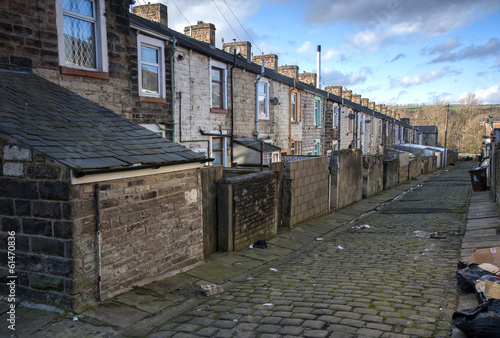 rear of terraced houses on lancashire cobbled street photo