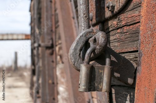 Old weathered latch and padlock on an vintage railway wagon