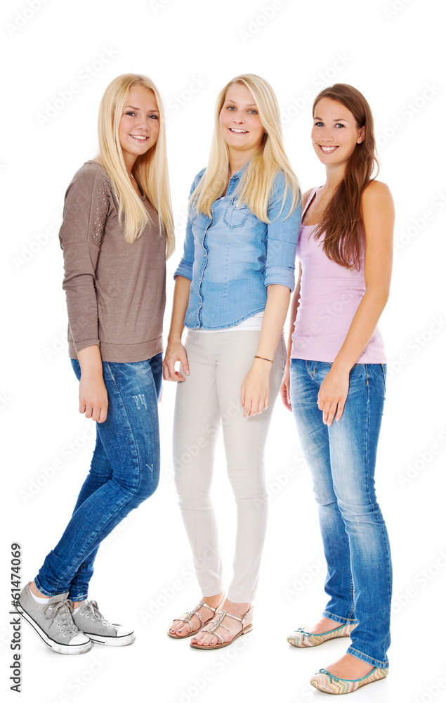 Three attractive girls standing next to each other. Three attractive girls standing next to each other.