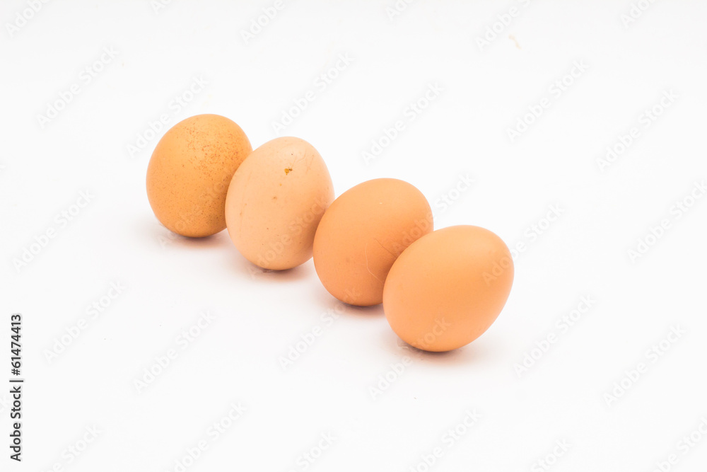 Brown eggs lined up diagonally on white background Brown eggs lined up diagonally on white background