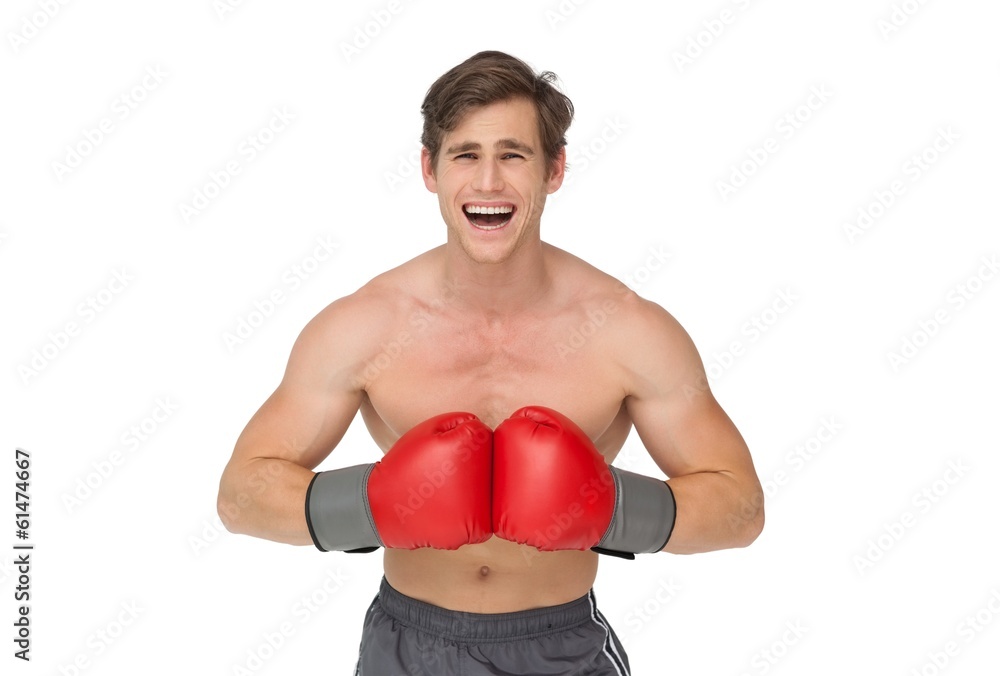 Fit man wearing red boxing gloves and shouting Fit man wearing red boxing gloves and shouting