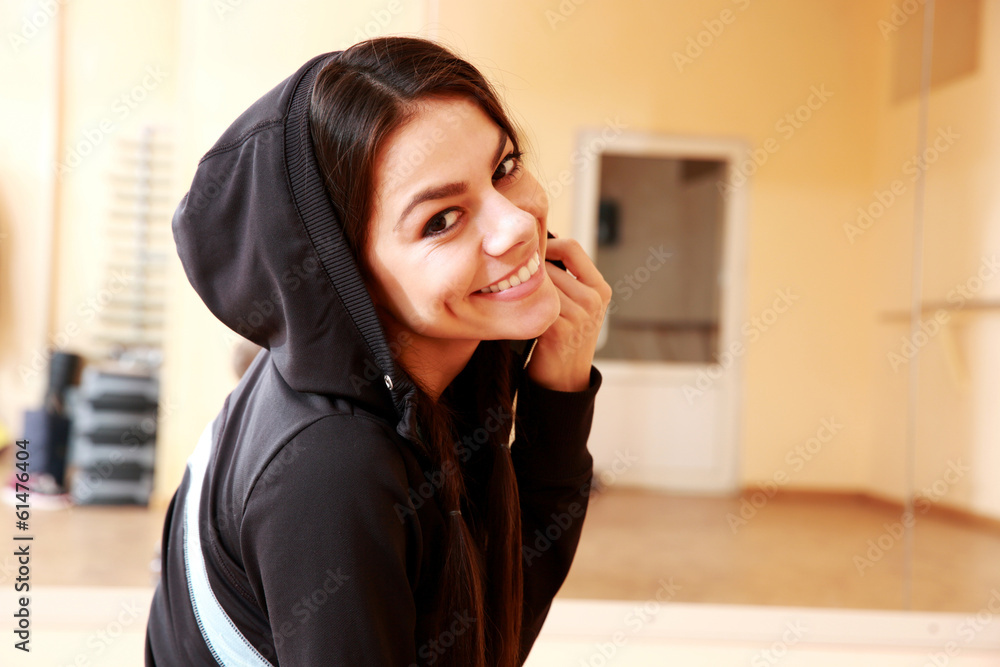 Portrait of a young cheerful fit woman at gym Portrait of a young cheerful fit woman at gym
