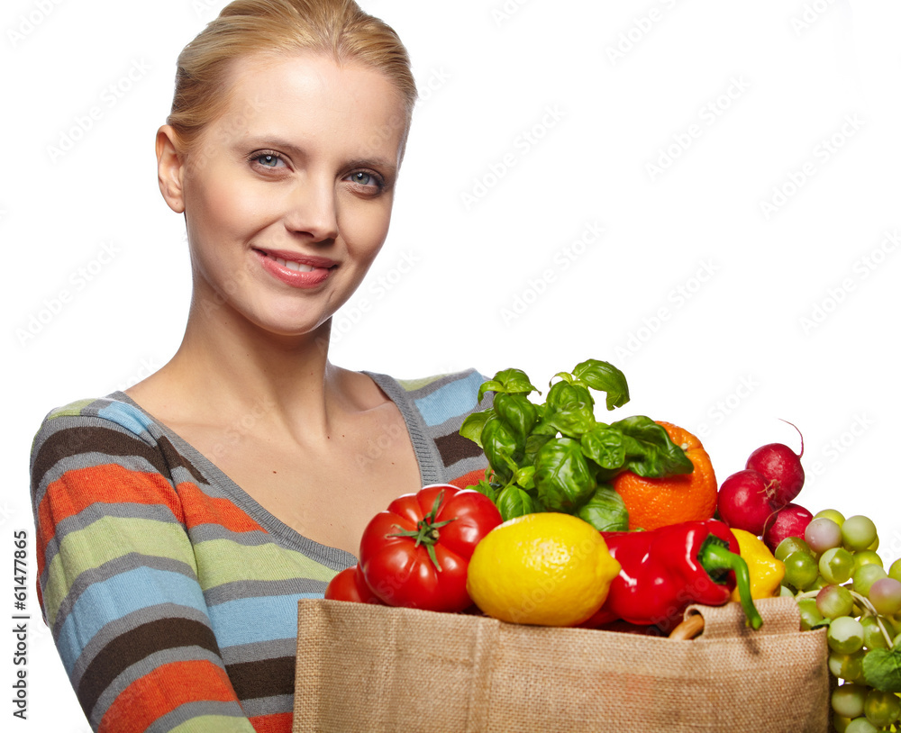 Young woman with a grocery shopping bag. Isolated on white backg Young woman with a grocery shopping bag. Isolated on white backg