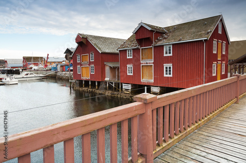 Red wooden houses in small Norwegian fishing village