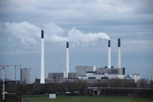 Factory chimneys at energy plant on a cloudy day