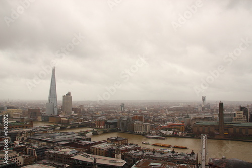 Dark sky and rain over wet London panorama view
