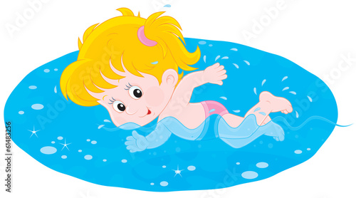 Little girl swims in blue water