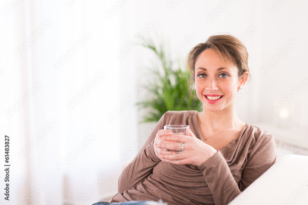 healthy young women drinking mineral water