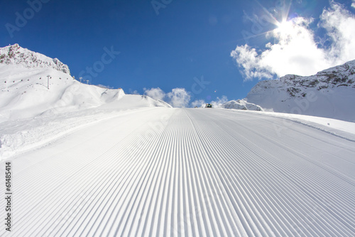 perfectly groomed empty ski piste