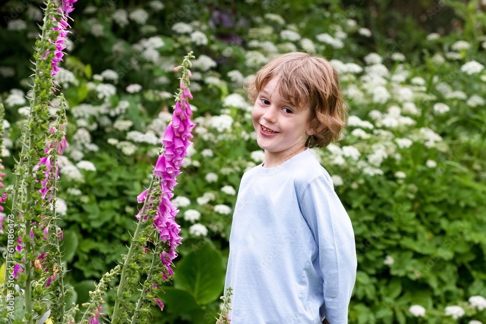 Cute little boy playing in the garden Cute little boy playing in the garden