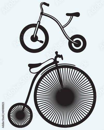 Old bicycle isolated on blue background