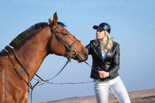Woman fondles horse