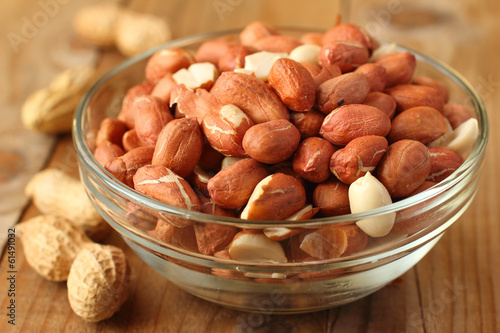 Raw peanuts or groundnuts in a glass bowl