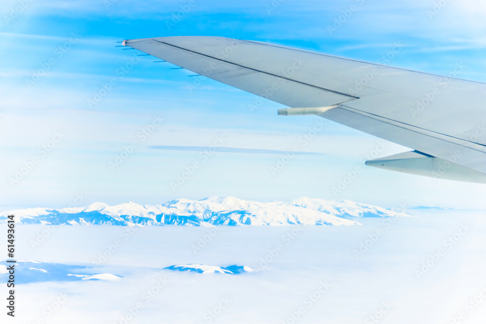 Fototapeta premium view of the wing of an airplane through the window