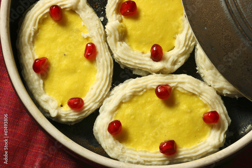 Rasagolla is a popular cheese based, syrupy sweet dish photo