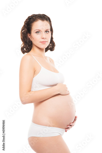 A happy pregnant woman isolated on white © Acronym
