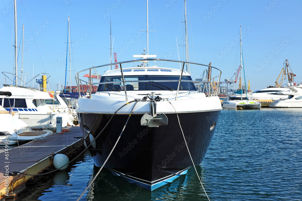 Motor yacht over harbor pier, Odessa, Ukraine Motor yacht over harbor pier, Odessa, Ukraine