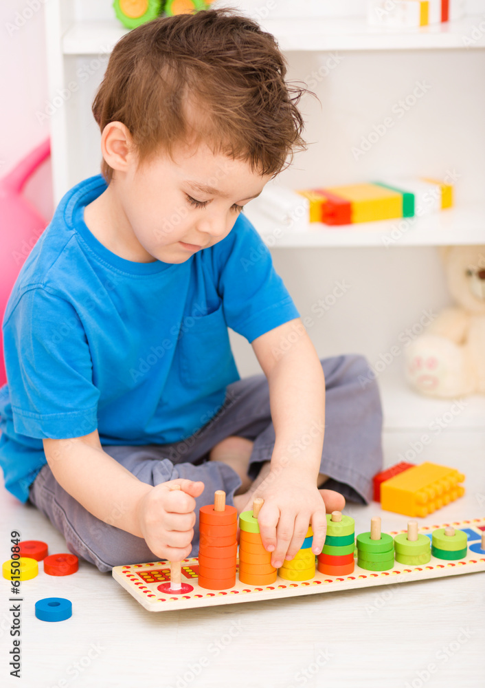 Boy is playing with building blocks Boy is playing with building blocks