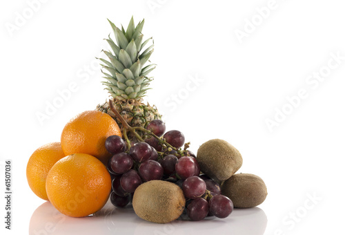 fruit as oranges pineapple grapes and kiwi