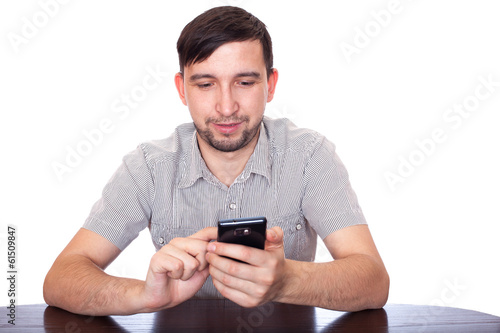 Man with smartphone. Writing, reading SMS, talking © Andrius Vaišnoras