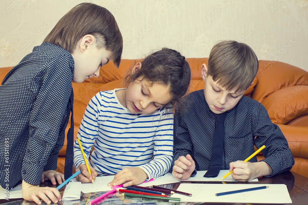 children draw with crayons on paper children draw with crayons on paper